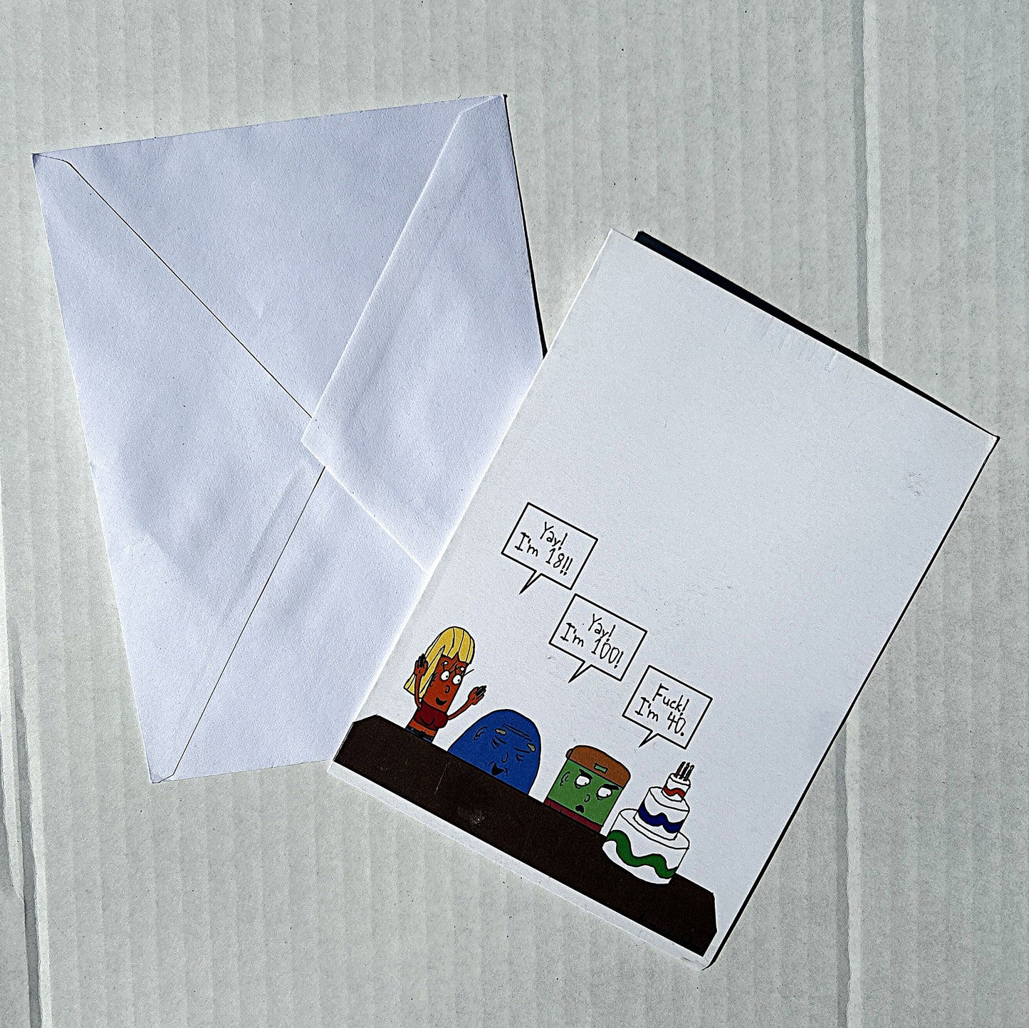 Greeting card with cartoon characters and envelope on a light gray background