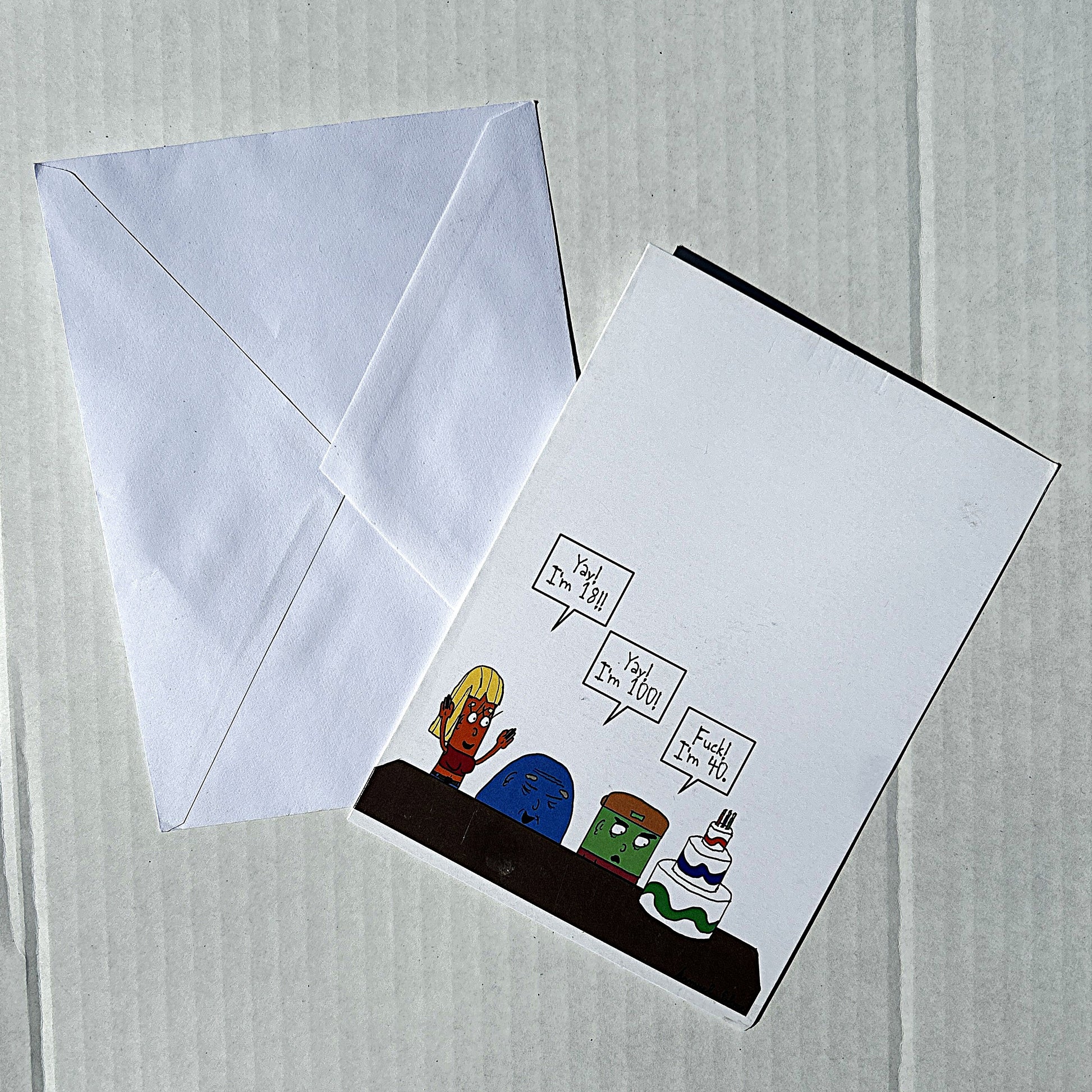 Greeting card with cartoon characters and envelope on a light gray background